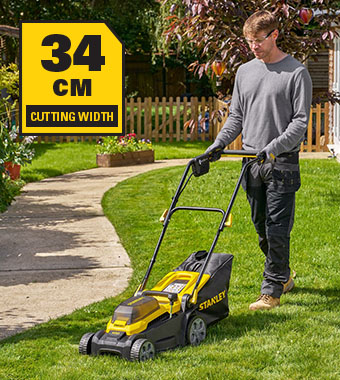 Stanley FatMax SCMWP340 Cordless Lawnmower 18V – 34cm Cutting Width Stanley FatMax V20 18V cordless lawnmower SCMWP340 in use on garden lawn – 34cm cutting width