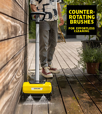 Kärcher PCL 6 Electric Decking Cleaner – Counter-Rotating Brushes Man cleaning a wooden deck with the Kärcher PCL 6 electric decking cleaner and its counter-rotating brushes
