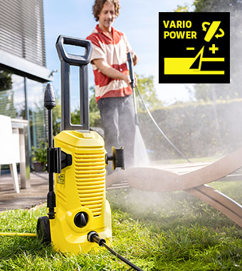 Kärcher K 2 Pressure Washer – Vario Power Lance Kärcher K 2 pressure washer on a lawn, with its Vario Power lance being used to clean garden furniture